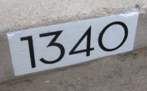 Painted Numbers Onto a Curb